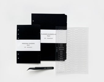 May include: Black planner dividers and personal dividers with the text "MY-ROADMAP" and "PLANNER DIVIDERS A5 black" and "PERSONAL DIVIDERS black". A clear plastic sheet with tabs labeled "NOTES", "APPOINTMENTS", "BUDGET", "GOALS", "CONTACTS" and a black pair of tweezers.