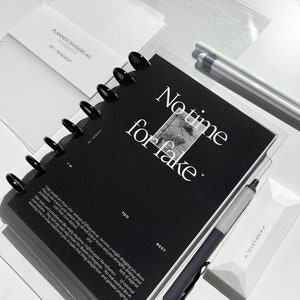 May include: A black planner divider with the text "No time for fake" in white lettering. The divider has a black and white image of a tree and the words "Too" and "Busy" printed on the bottom.