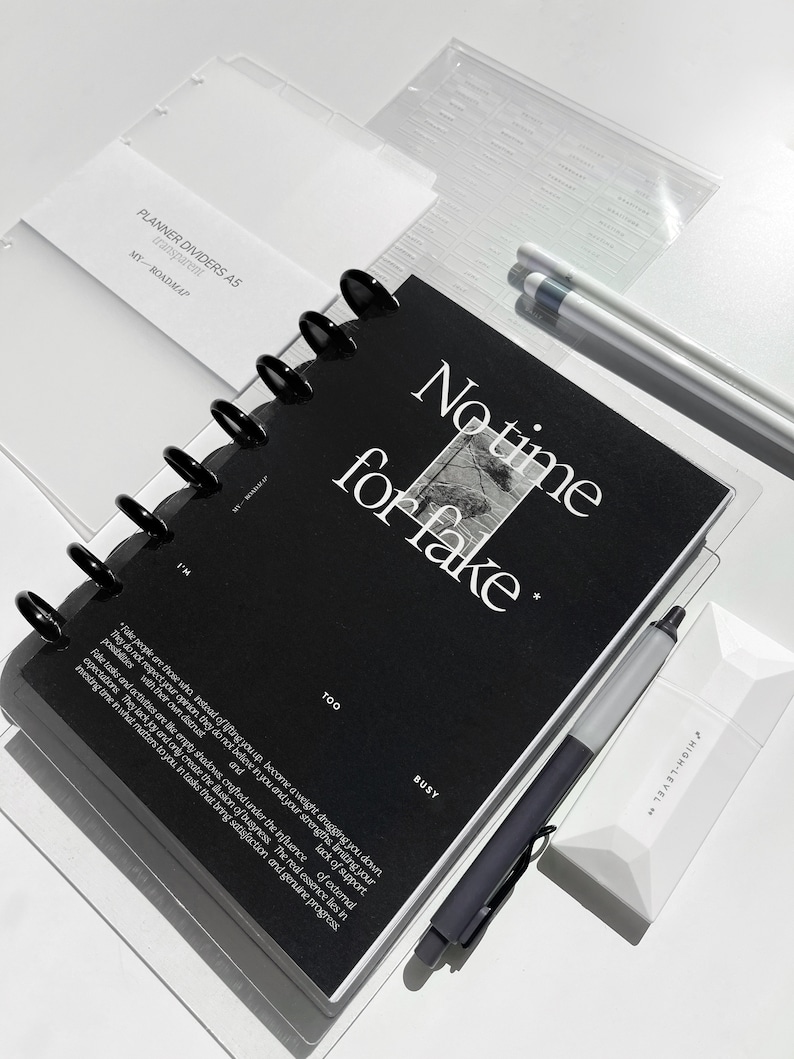 May include: A black planner divider with the text "No time for fake" in white lettering. The divider has a black and white image of a tree and the words "Too" and "Busy" printed on the bottom.
