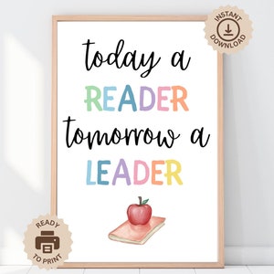 Pode incluir: Arte de parede imprimível com o texto "today a reader tomorrow a leader" em letras coloridas. Uma maçã vermelha e um livro fechado são ilustrados abaixo do texto.