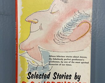 May include: A red, yellow, and white book cover with a cartoon illustration of a man's face. The title of the book is "Selected Stories by P.G. WODEHOUSE" with the text "With an Introduction by John W. Aldridge" below the title.
