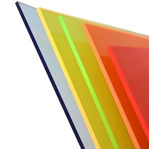 May include: A stack of colorful acrylic sheets in shades of blue, yellow, green, orange, and red. The sheets are arranged at an angle, showcasing their vibrant colors and translucent quality. The edges are clean and smooth.