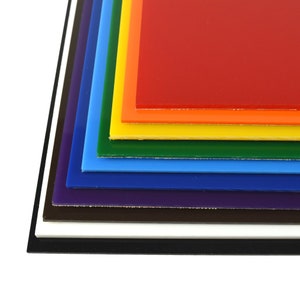 May include: A stack of colorful acrylic sheets in rainbow order, from red to black. The sheets are layered on top of each other, creating a gradient effect.