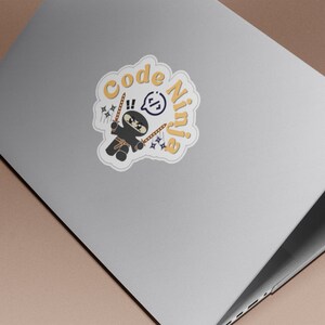 May include: A sticker featuring a cartoon ninja holding two swords and the text "Code Ninja" in a yellow cloud.