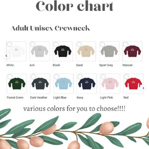 May include: Colour chart displaying a range of adult unisex crewneck sweatshirts. The colours available are white, ash, black, sand, sport grey, maroon, forest green, dark heather, light blue, navy, light pink, and red.