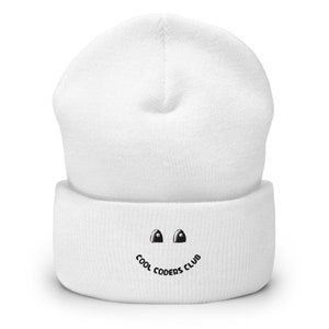 May include: White knit beanie with a black embroidered smiley face and the text "Cool Coders Club".