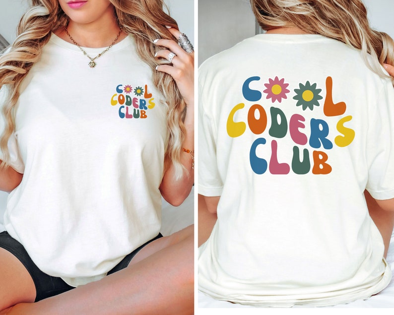 May include: White t-shirt with a colourful graphic that says "Cool Coders Club" with flowers. The graphic is on the front of the shirt and the back of the shirt.