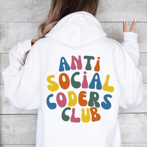 May include: White hoodie with a colourful graphic on the back that says "Anti Social Coders Club".