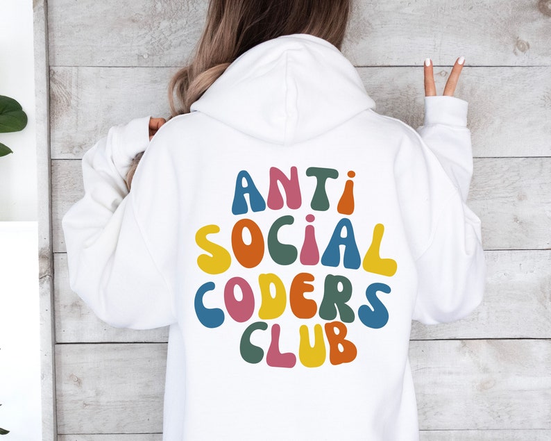 May include: White hoodie with a colourful graphic on the back that says "Anti Social Coders Club".