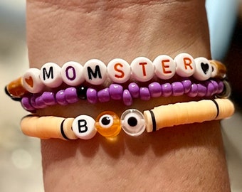 Halloween Bracelets Stack of 3- MOMSTER. BOO. Orange. Black. Purple. Evil Eye. Beads are glass seed, ceramic, heishi, acrylic, silver metal.