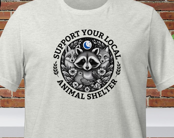 Show Your Love for Animals with 'Support Your Local Animal Shelter' Quote on our Unisex Graphic Tee with Cute Woodland Animal Graphic