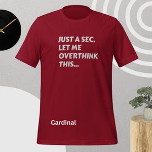 Front view, cardinal color, flat mock-up, Funny Quote T-Shirt - Printed With: 'Just a Sec, Let Me Overthink This' - Unisex Tee for Fans of Funny, Relatable Humor