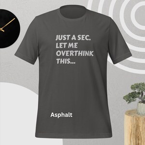 Front view, asphalt color, flat mock-up, Funny Quote T-Shirt - Printed With: 'Just a Sec, Let Me Overthink This' - Unisex Tee for Fans of Funny, Relatable Humor