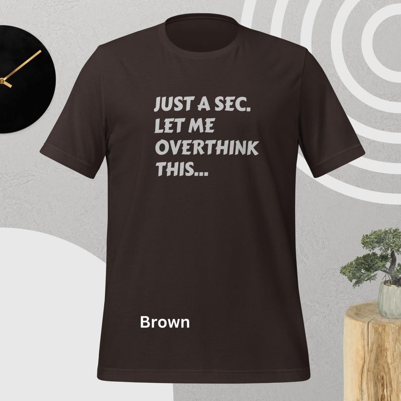 Front view, brown color, flat mock-up, Funny Quote T-Shirt - Printed With: 'Just a Sec, Let Me Overthink This' - Unisex Tee for Fans of Funny, Relatable Humor