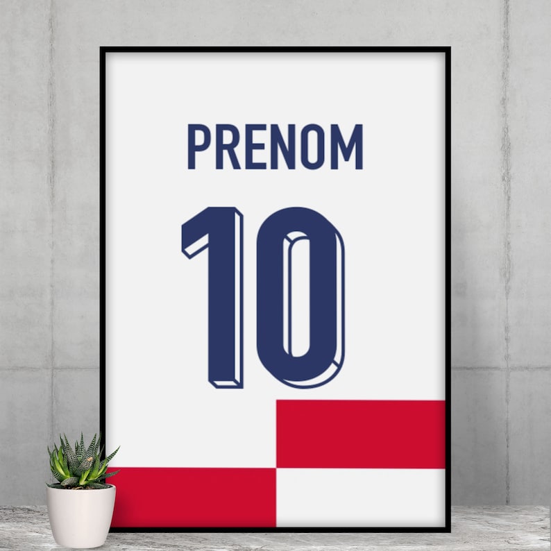 May include: A white framed poster with a blue and white number 10 and the word "PRENOM" in black text. The poster has a red and white checkered background.