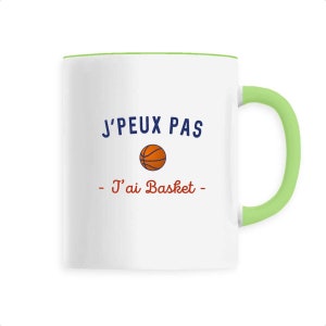 May include: White ceramic mug with a green rim and handle. The mug features a basketball graphic and the text "J'PEUX PAS - J'ai Basket -" in blue and red.