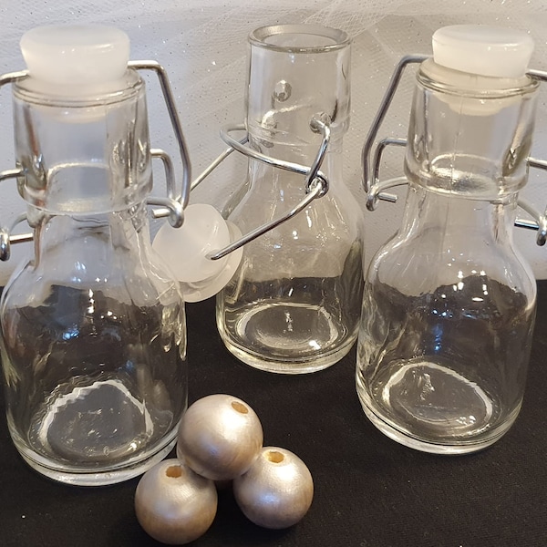 Set of 3 Petite Treat Small Glass Favor Bottles with Swing Top.