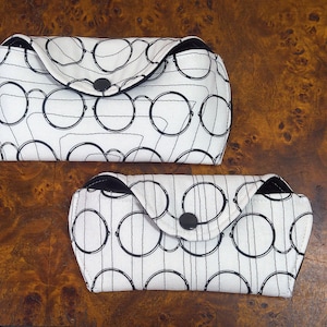 Fabric glasses cases in two sizes with a snap closure.
