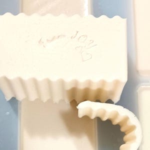 A fine batch of soap being made! With the "bend test" next to it - Our soap bends because it's filled with LOTION!