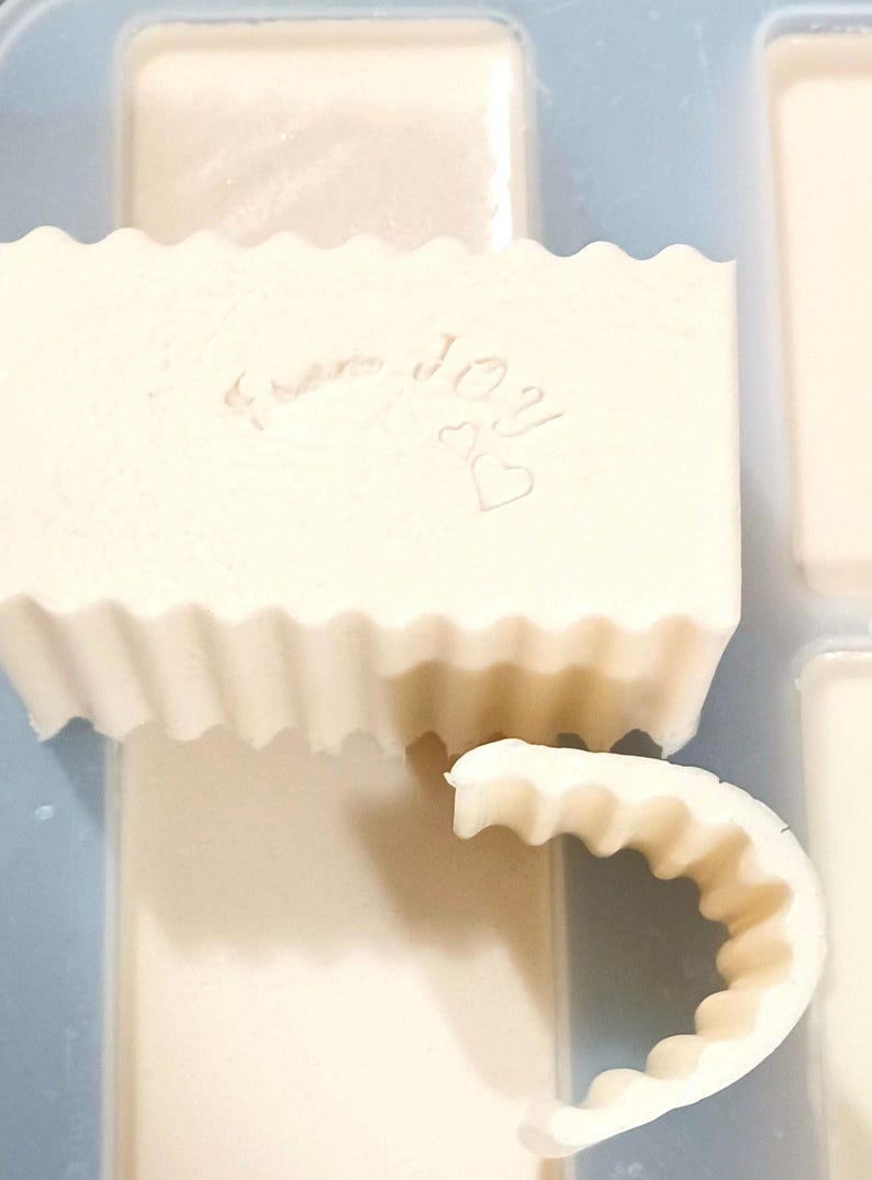 A fine batch of soap being made! With the "bend test" next to it - Our soap bends because it's filled with LOTION!