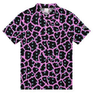 May include: Black polo shirt with a pink giraffe-like pattern and diamond accents. The shirt has a collared neckline and short sleeves. The text "CLUB LAB" is visible on the right sleeve.