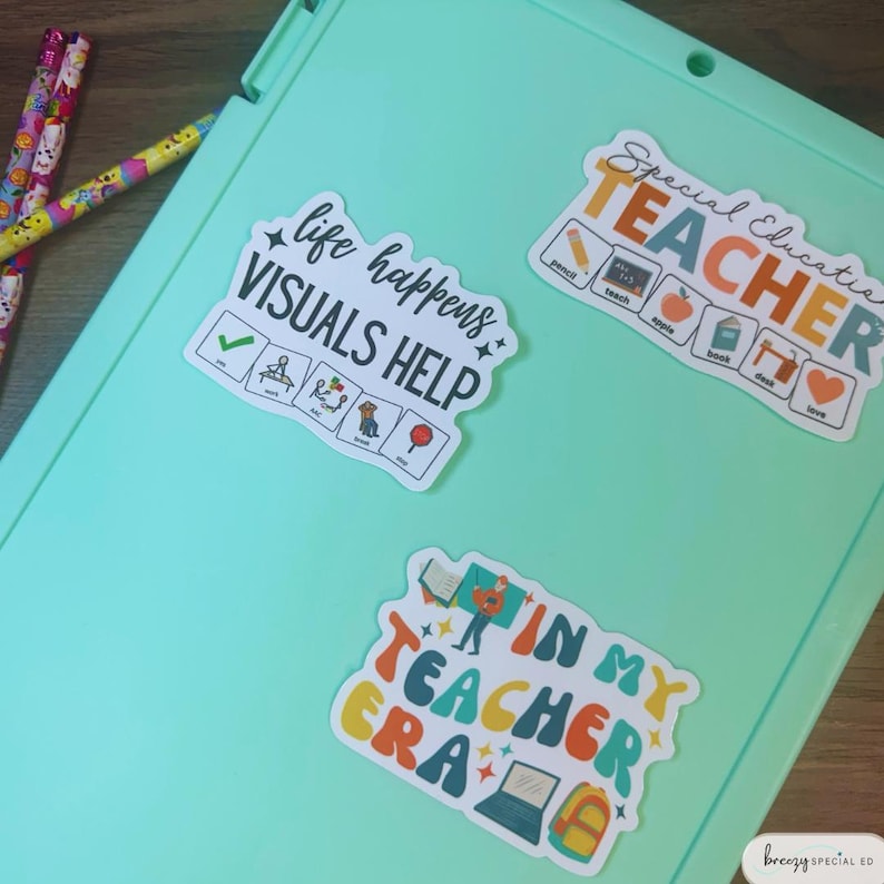 May include: Three colorful stickers with text and illustrations. The first sticker says "Special Education Teacher" with a rainbow color scheme. The second sticker says "Life Happens, Visuals Help" with a green checkmark and other illustrations. The third sticker says "In My Teacher Era" with a cartoon teacher and a laptop.
