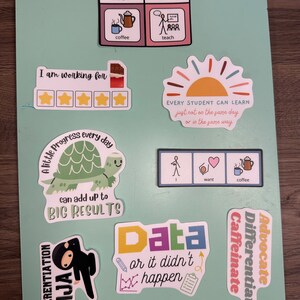 May include: A green chalkboard with colorful stickers featuring motivational quotes and illustrations. The stickers include a turtle, a ninja, a sun, a coffee pot, and a cup of coffee. The text on the stickers includes "A little progress every day can add up to BIG RESULTS", "Data or it didn't happen", "Every student can learn just not on the same day or in the same way", "I am working for", "Differentiate", "Caffeinate", and "Advocate".