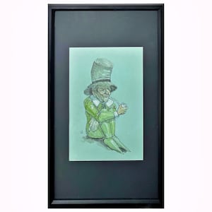 May include: Framed artwork featuring a seated leprechaun illustration. The leprechaun is depicted in green attire, including a tall hat, and is smoking a pipe. The artwork is set against a light green background and framed in black.