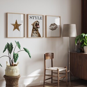 May include: Three framed prints with a white background. The left print features a star-shaped design with a leopard print pattern. The middle print features a leopard print design with the word "STYLE" in black text. The right print features a leopard print design of a pair of lips.