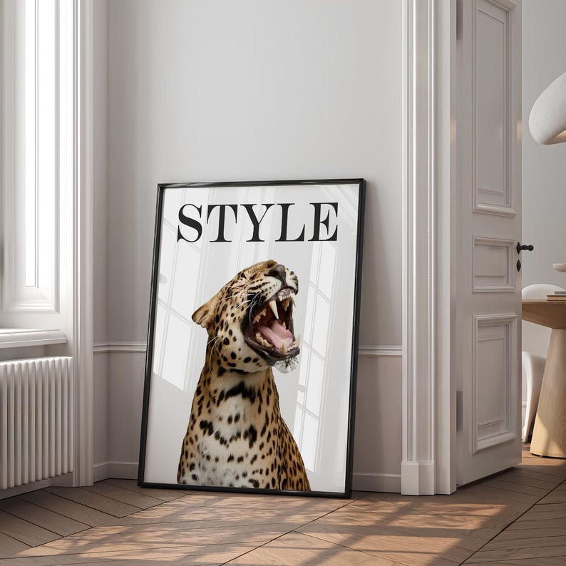 May include: A black framed poster with the word "STYLE" in bold white letters. The poster features a close-up of a leopard with its mouth open, revealing sharp teeth.