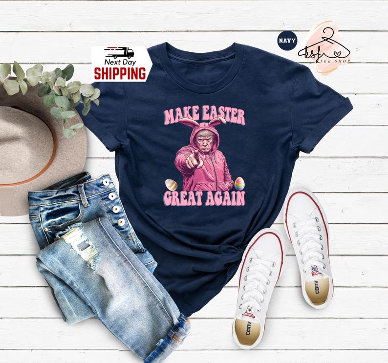 May include: A navy blue t-shirt with a graphic of a person wearing a pink bunny costume and the text "Make Easter Great Again".