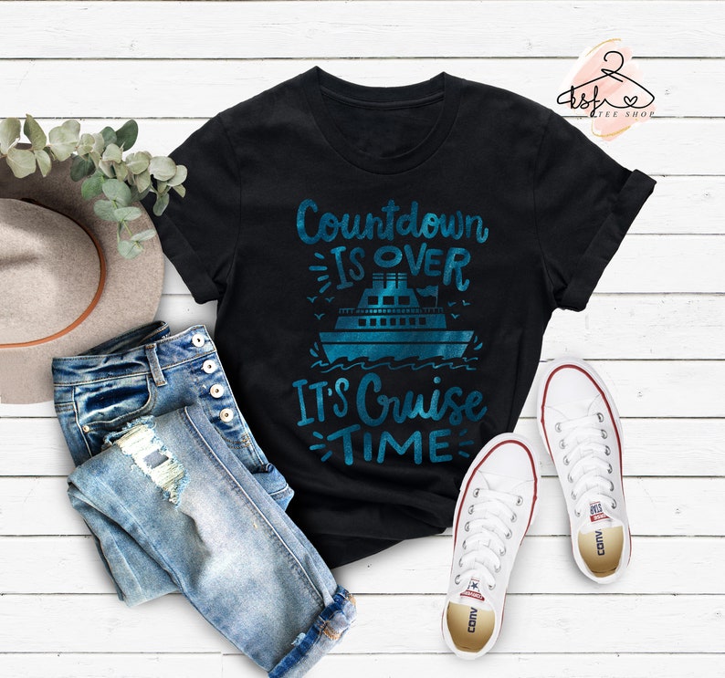 May include: Black t-shirt with a blue graphic of a cruise ship and the text "Countdown is over, It's Cruise Time".