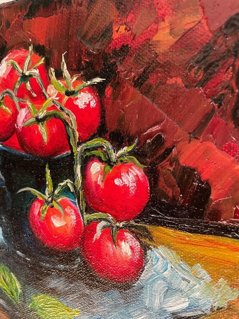 May include: A still life painting of red tomatoes on a vine in a blue bowl. The tomatoes are arranged in a cluster, with some spilling out of the bowl. The background is a dark red.