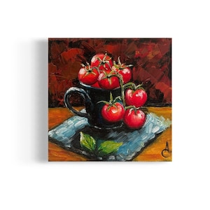 May include: A still life painting of a black ceramic mug filled with red tomatoes on a blue napkin. The tomatoes are on a vine and there is a green basil leaf on the napkin.