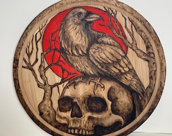 Teschio e corvo, pirografia e colori acrilici su legno