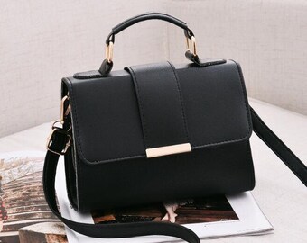 Mini crossbody handbag with handle. 5 colours to choose from. 3 compartments. inner zip