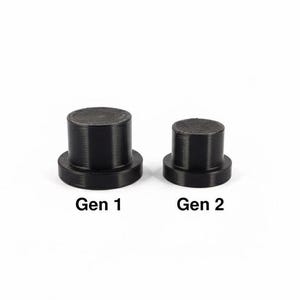 May include: Two black cylindrical objects with a flat base and a shorter, narrower top. The text "Gen 1" and "Gen 2" are printed below each object, respectively. The objects are set against a white background.