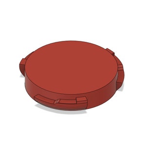 May include: A round, red plastic lid with a textured edge. The lid has a smooth, flat top.