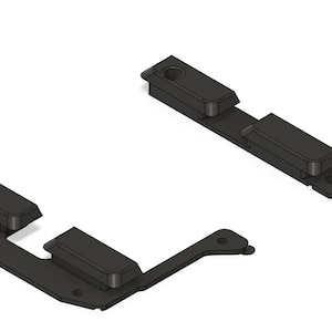 May include: Two black plastic pieces for a 3D printed model. The pieces are designed to fit together to create a larger object.