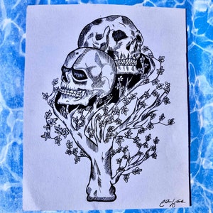 Hollow tree of skeleton heads print