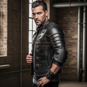 May include: Black leather jacket with armor-like shoulder and arm details. The jacket features multiple buckles, zippers, and a wrist cuff. The text "MADE TO HIDES SINCE 2020" is visible on the jacket.