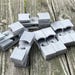 Hang 'Em Up: 15-Pack Black Fishing Reel Wall Mounts For 3K To 10K Spinning Reels
