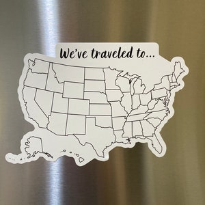 May include: A white outline map of the United States with the text "We've traveled to..." at the top. The map is on a stainless steel surface.