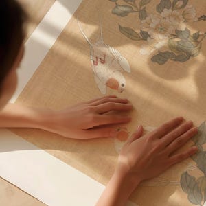 May include: A detailed illustration of a bird with white and peach-colored feathers, set against a beige background with floral and leaf motifs. The artwork is reminiscent of traditional Asian art styles.
