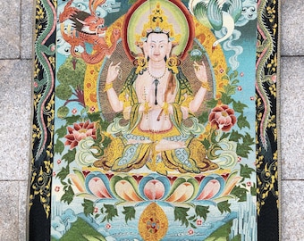 May include: A colorful tapestry featuring a seated figure with a golden halo, surrounded by dragons, birds, and floral motifs. The artwork has a black border with intricate designs and is set against a blue and green background.