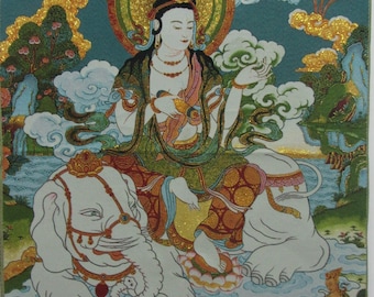 May include: A detailed tapestry depicting a seated figure with a golden halo, riding a white elephant. The figure is adorned in colorful robes and jewelry, set against a backdrop of mountains, clouds, and other figures. The artwork has a teal border.