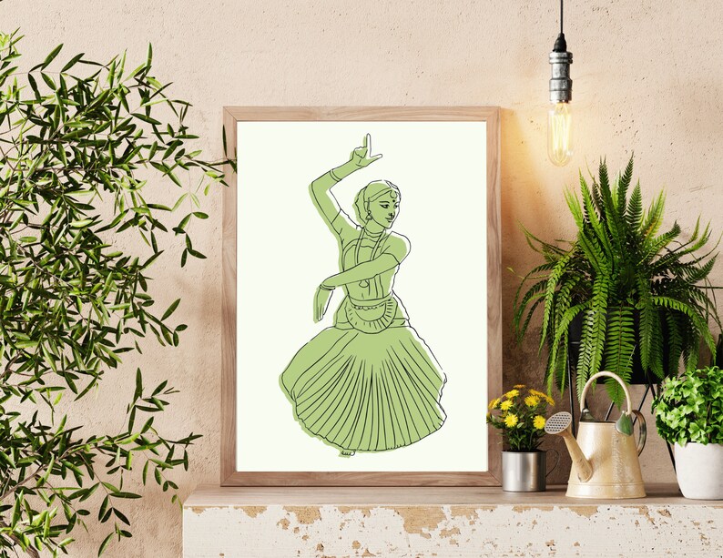 May include: A framed line drawing of a woman in a green dress performing a traditional Indian dance. The woman is wearing a headdress and jewelry. The drawing is on a white background.