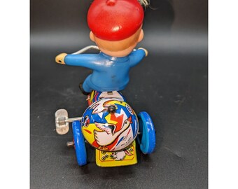 Lithograph Tin Toy Boy on Tricycle Wind up Moves Bell Rings