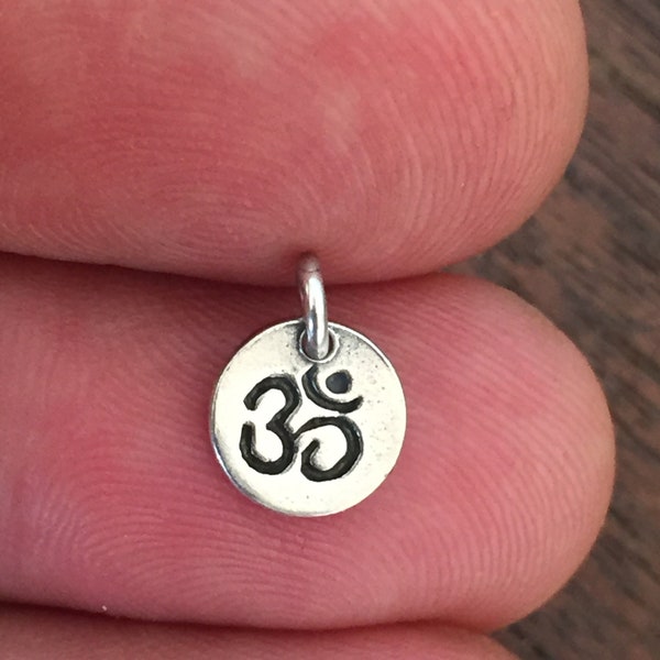 Tiny Om Charm In Sterling Silver