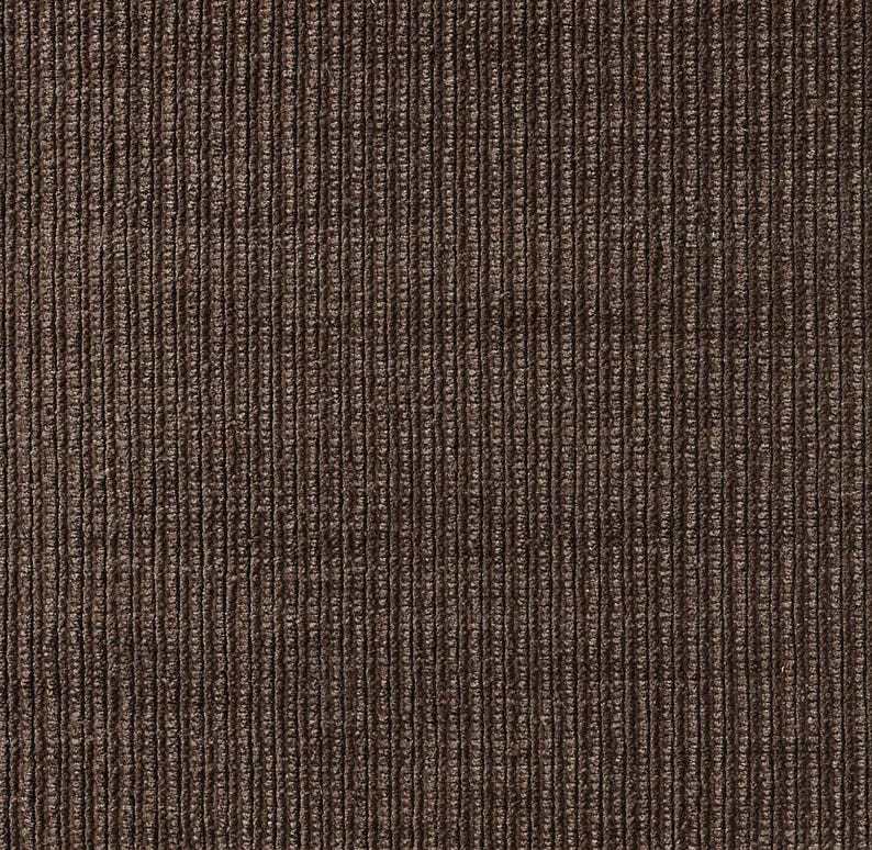 May include: A dark brown fabric featuring a distinct vertical ribbed texture. The material displays a consistent pattern of raised parallel lines running from top to bottom, creating a deep, shadowed appearance between each individual corded ridge.